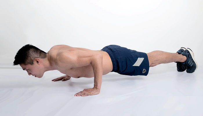 Isometric push up fitness test showing the lowered hold position