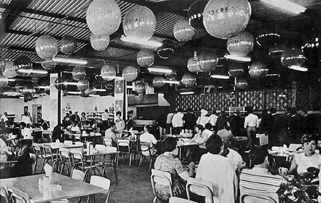Athletes enjoying a meal at the Olympic Village food hall