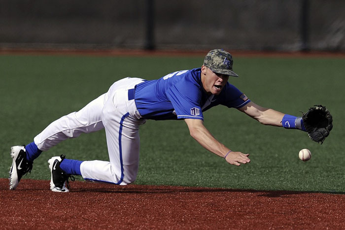 Baseball player stretching demonstrating the physical demands of professional baseball