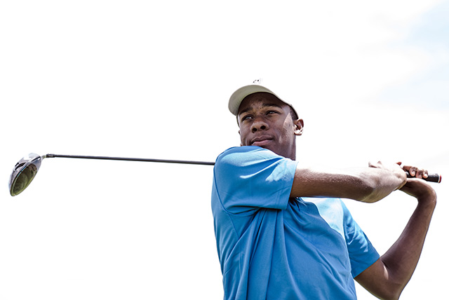 Golf swing demonstration at a professional tournament
