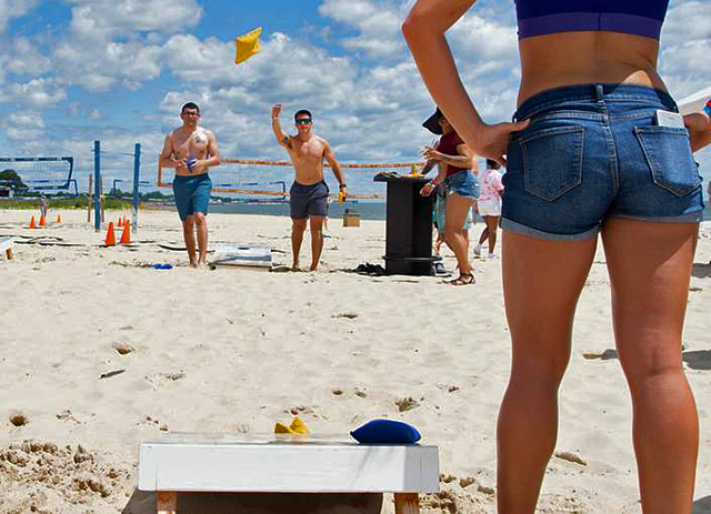 cornhole game at the beach