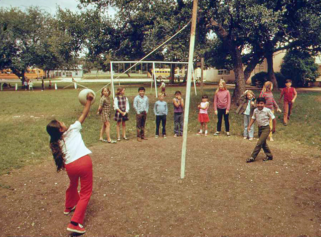 children playing a tetherball game