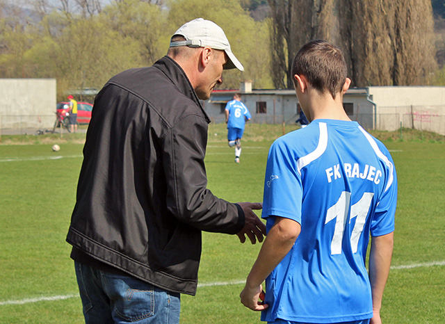 Football coach in action during a match