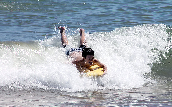 boy bodyboarding