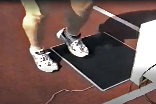 athlete performing foot tapping test on timing mat
